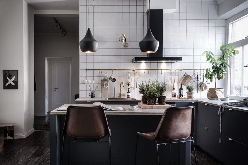 Swedish apartment with dark floor styled by Emma Hos