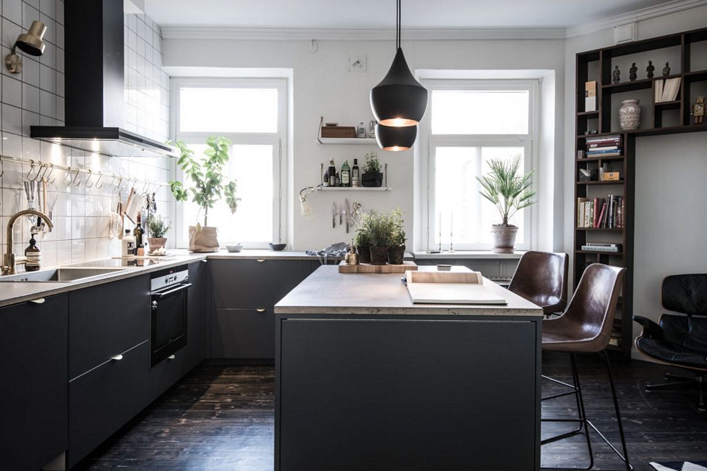 Swedish apartment with dark floor styled by Emma Hos