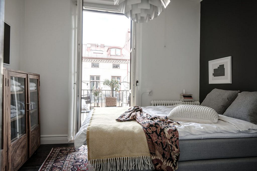 Swedish apartment with dark floor styled by Emma Hos