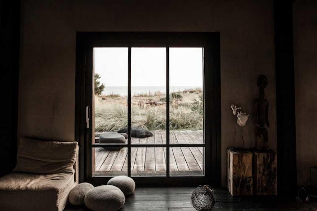 Light, wood, and stone make a cottage refuge