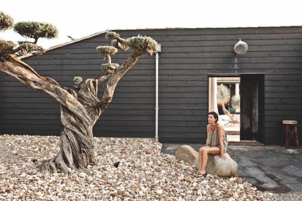 Light, wood, and stone make a cottage refuge